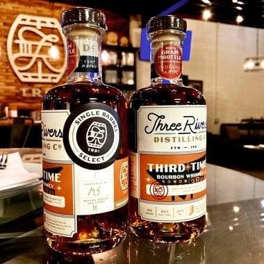 Two bottles of Three Rivers Distilling Third Time Bourbon side by side.