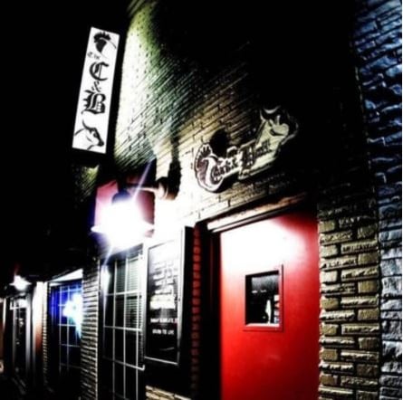 Cock and Bull Neighborhood Pub’s facade with the signage that reads “CB”.